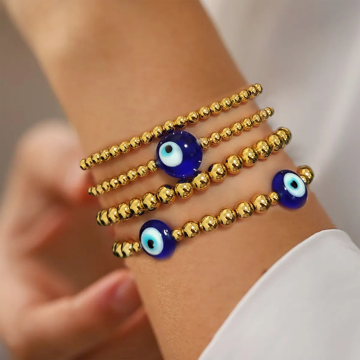 women's gold-plated bracelets-Streetwear Eye Metal Beaded Knitting Women'S Bracelets